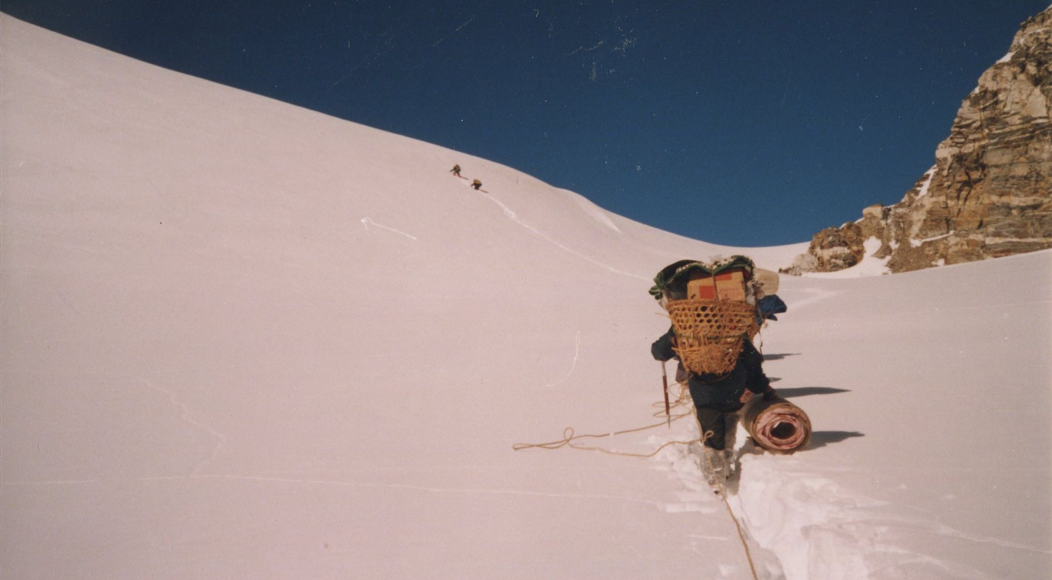 Climbing final snow slopes to Tilman's Pass