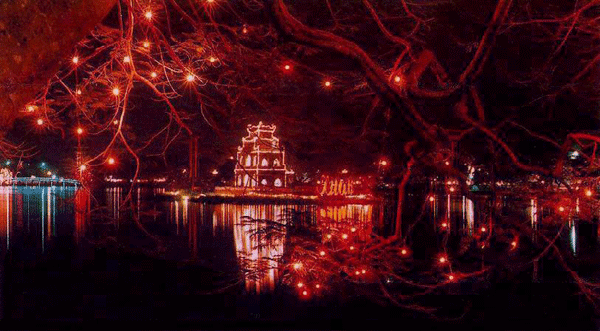 The Tortoise ( Turtle ) Tower ( Thap Rua ) in Sword Lake ( Ho Hoan Kiem ) in Hanoi illuminated at night