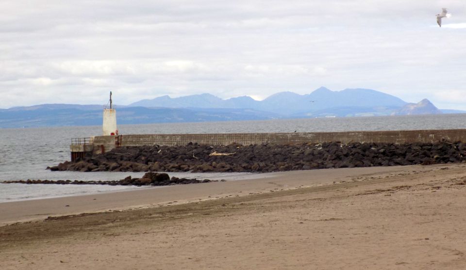 Hills of Arran beyond harbour wall at Girvan