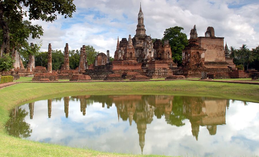 Chedi ( Buddhist Shrines ) at Sukhothai Historical Park in Northern Thailand